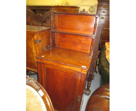 Small Regency mahogany chiffonier with a shelf back on turned supports, above a single panel door raised on low bun feet