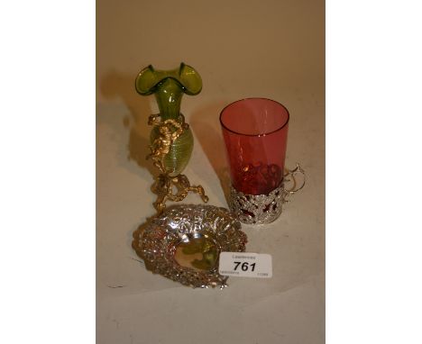 Silver glass holder with associated cranberry beaker, a small pierced and embossed silver trinket dish and a gilt metal spill