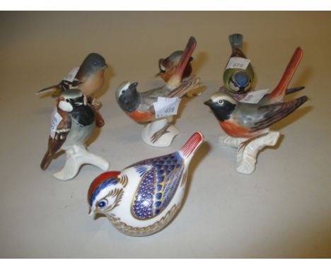 Royal Crown Derby paperweight in the form of a bird together with six other Goebel, Beswick and Royal Worcester figures of bi
