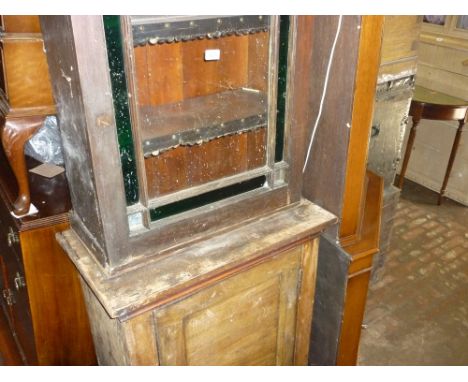 Mahogany bookcase with a glazed door above a panel door (a/f)