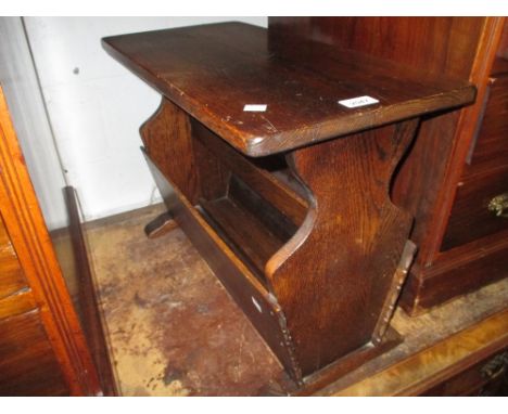 Reproduction oak occasional table / magazine rack together with an oak framed firescreen with needlework insert