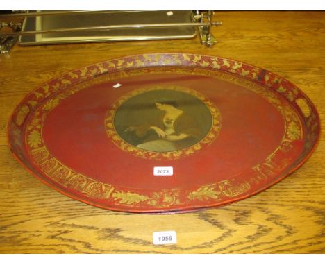 19th Century oval red toleware tray painted with a portrait of a seated lady