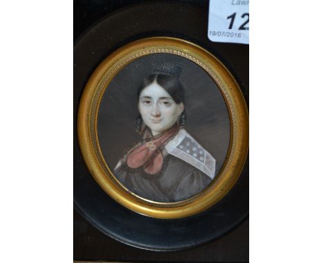 19th Century watercolour portrait miniature on ivory of a lady wearing a red scarf and lace collar together with another of a