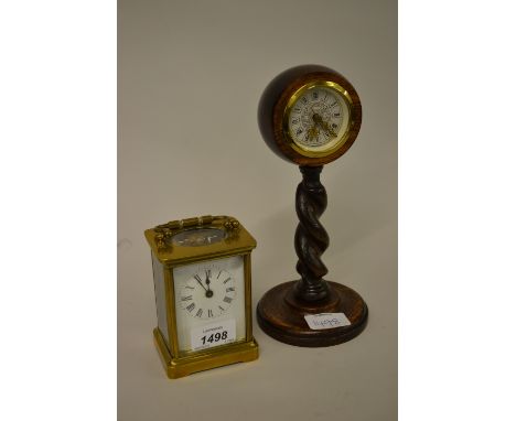 Early 20th Century French gilt brass carriage clock together with a small oak carriage clock on a barley twist column
