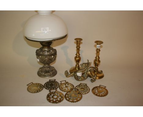 Pair of 18th Century brass baluster stem candlesticks, small quantity of horse brasses, bronze figure of a dragon and a metal