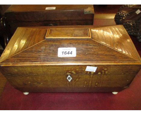 George III rosewood and inlaid sarcophagus shaped tea caddy on ivory ball feet