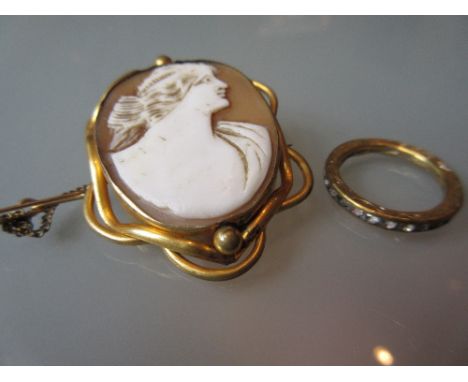 Carved shell cameo portrait brooch and an eternity ring