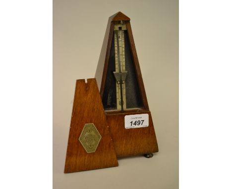 French walnut metronome together with a reproduction barometer 