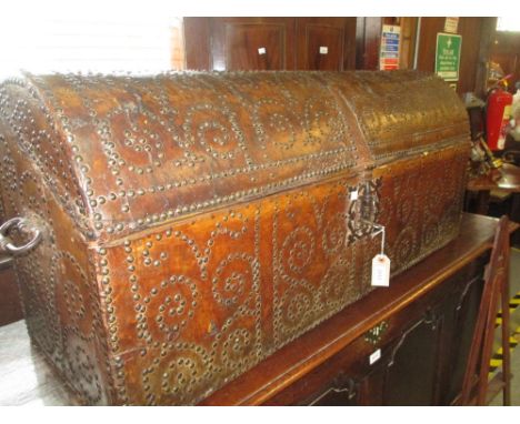 18th Century French leather and brass studded dome topped trunk with iron work end handles and original decorative iron work 