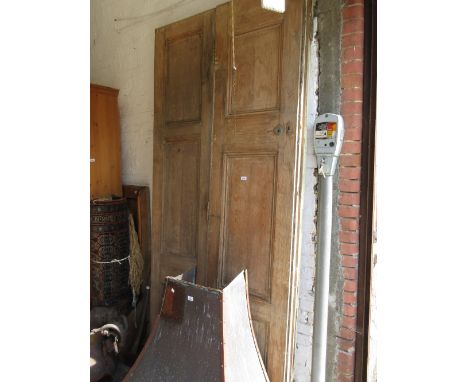 Set of four large 19th Century stripped pine three panel doors, 105ins high x approximately 92ins wide total