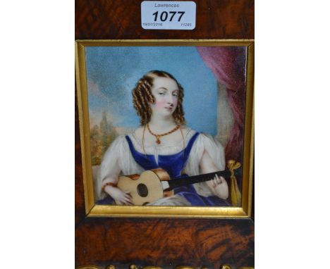 19th Century watercolour portrait miniature on ivory of a seated girl playing a guitar before an open window, 6ins x 5ins, mo