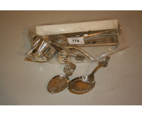 Two Dutch silver embossed caddy spoons and a quantity of various Continental silver and other napkin rings, swizzle sticks et