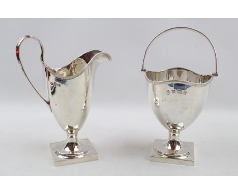 George III Style Silver Helmet shaped jug Birmingham 1964 and a Silver Helmet shaped Cream jug 1964. 260g total weight 