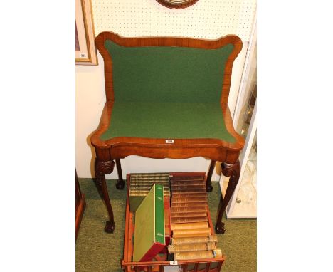 20thC Walnut Shaped top Baize inlaid fold over card table on carved ball and claw legs. 76cm in Diameter 