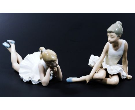 A Nao Lladro figure of recumbent ballerina, 22cm wide, and another seated, printed marks beneath.  (2, boxed)