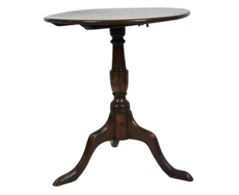 An 18thC oak tripod snap top table, the circular top on shaped stem and triple cabriole supports, 70cm high, 65cm dia.