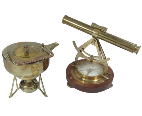 A mahogany finish and brass table top marine style telescope and compass, centred by a level, the telescope 29cm wide, and a 