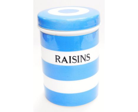 A mid 20thC TG Green Cornish ware blue and white jar, marked Raisins, with a removable lid, black shield mark beneath, 15cm h