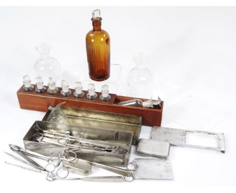 Various scientific and chemist bottles, to include a brown glazed press moulded example with part ribbed body and plain stopp