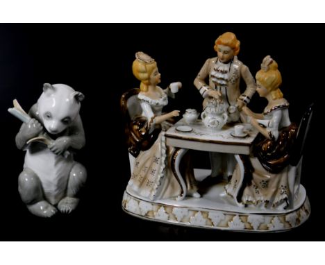 A Nao Lladro figure of panda, printed marks beneath, 16cm high, and a Japanese semi porcelain figure group of two ladies and 