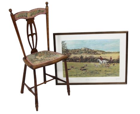 A early 20thC bedroom chair, with part pierced back splat, overstuffed top rail and shaped seat, on cylindrical supports join