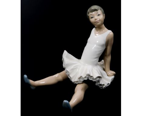 A Nao Lladro figure of a seated ballerina, 15cm high.  (boxed)