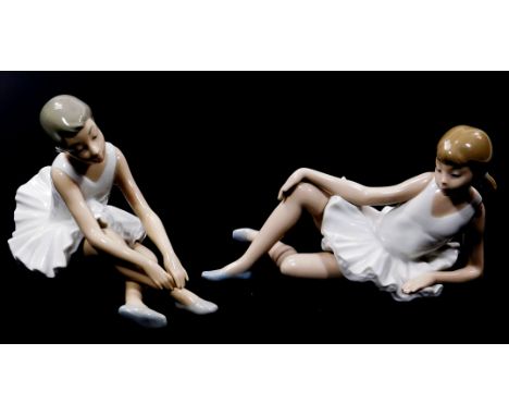 A Nao Lladro figure of a seated ballerina, 15cm high, and another similar.  (2, boxed)