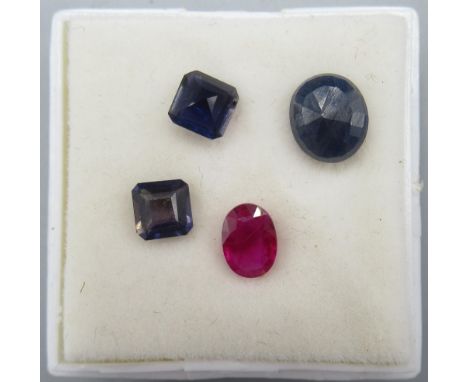 Oval cut unmounted sapphire, approx. weight 1.0 carat, an unmounted ruby, approx. weight 0.65 carat, and two unmounted blue s