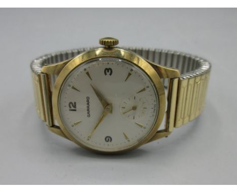 1960's Garrard presentation 9ct gold wristwatch, signed silvered dial, Arabic and baton hours, subsidiary seconds, case no. 3