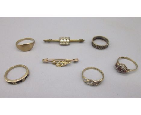9ct yellow gold ring set with rubies and white stones, stamped 375, size K, and three more 9ct gold rings, all stamped 375, 6