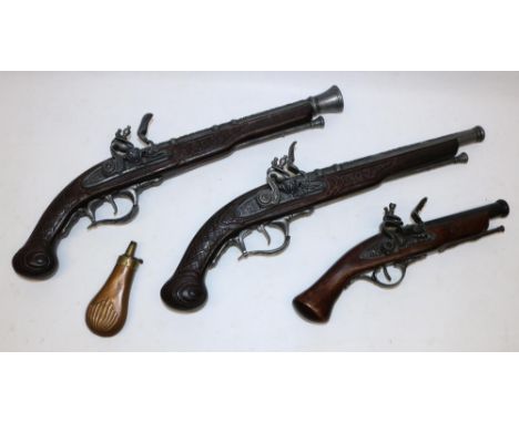 Pair of replica flintlock pistols, L48cm, another similar pistol, and a 19th century copper and brass powder flask (4) 