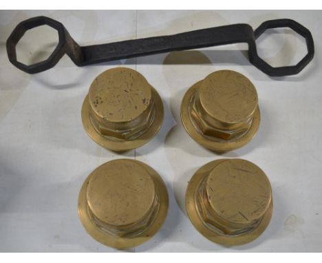 Four large brass carriage wheel nuts (diameter 13cm) and a large carriage spanner (does not fit bolts), no makers marks 