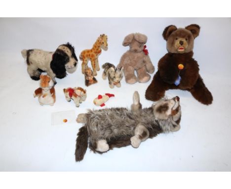 Collection of Steiff soft toys incl. a spaniel, tabby cat, giraffe,&nbsp; rabbit, 'Goldy' hamster, and a Steiff raccoon hand 