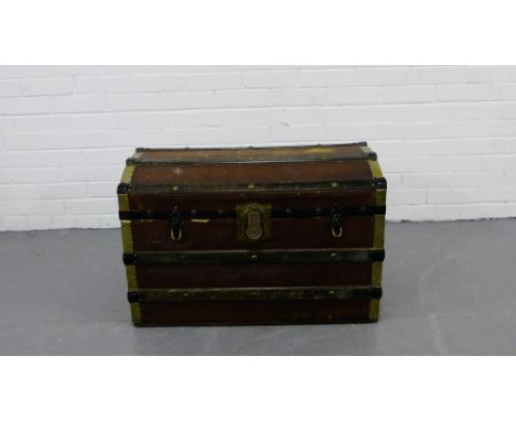 A domed top and brass bound storage trunk with a lift out tray to the interior, 50 x 75cm