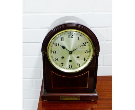 An early 20th century mahogany cased and domed top mantle clock, the silvered dial with Arabic numerals, 35 x 25cm  