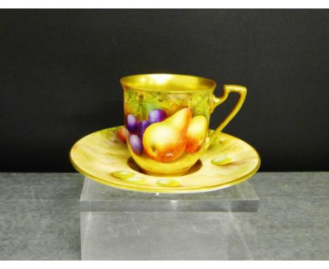 A Royal Worcester fruit decorated and gilded coffee cup and saucer, the cup signed Moseley and the saucer signed E. Townsend,