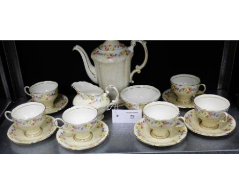 A Paragon bone china tea set painted with floral sprays and gilded scroll work comprising a teapot, milk and sugar, six cups 