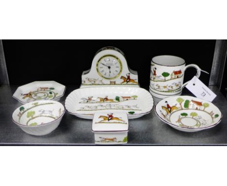 A collection of Wedgwood Hunting Scenes pattern porcelains to include a mantle clock, a tankard, a trinket jar and cover and 