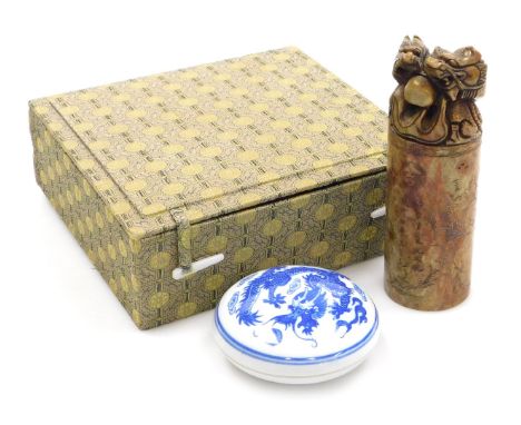 A Chinese soapstone seal, carved with two dragons and a flaming pearl, together with a blue and white porcelain seal paste bo