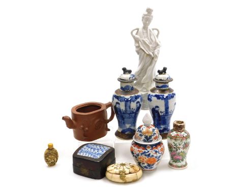 A group of Oriental ceramics and collectables, including a blanc-de-chine figure of Guanyin, an Imari jar and cover, a pair o