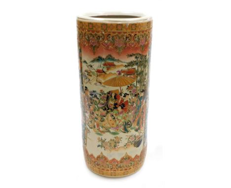 A late 20thC Chinese stick stand, in Japanese Satsuma style, of cylindrical form, decorated with reserve panels of figures, o
