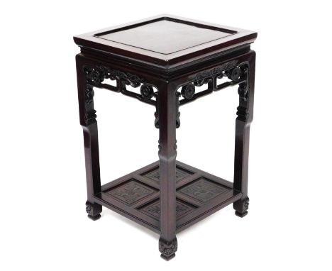 A late 19thC Chinese rosewood urn stand, the square top with recessed centre, with open stylised scroll gallery below and squ