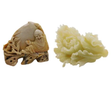 A Chinese white jade carving of a cabbage, 14.5cm wide and a soapstone carving of Shoulao with a peach and small boy, raised 