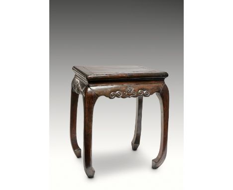 A RARE CHINESE ZITAN STOOL QIANLONG 1736-95 The recessed top above an apron carved with scrollwork and a central ruyi-head, r