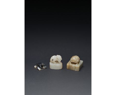 THREE CHINESE JADE SEALS MING AND QING DYNASTIES One in white jade, carved with a mythical beast standing with its head turne