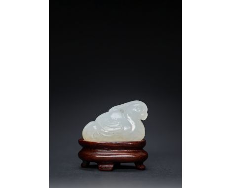 A FINE CHINESE WHITE JADE CARVING OF A MANDARIN DUCK MING OR EARLY QING DYNASTY The white stone with delicate amber coloured 