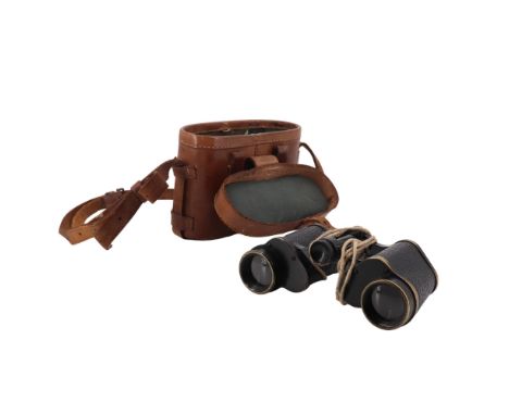 A pair of early 20th Century British Army binocular field glasses bearing an impressed broad arrow mark, in leather case, 16 