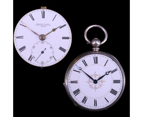 An early 20th Century white-metal slender open-faced pocket watch, having a key-wound movement, white enamel face, blued stee