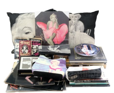 A collection of Marilyn Monroe memorabilia including bags, books, etc