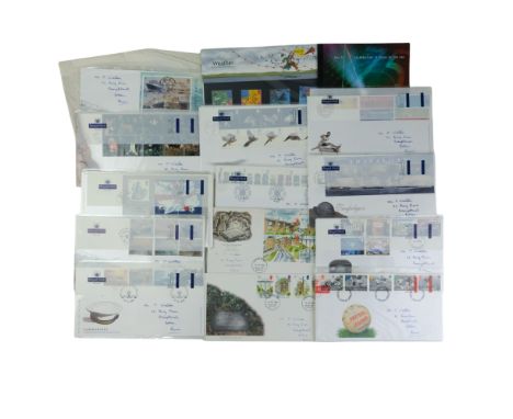 A small group of QEII first day stamp covers together with a BBC 75 year stamp book, a Weather mint stamp pack, etc